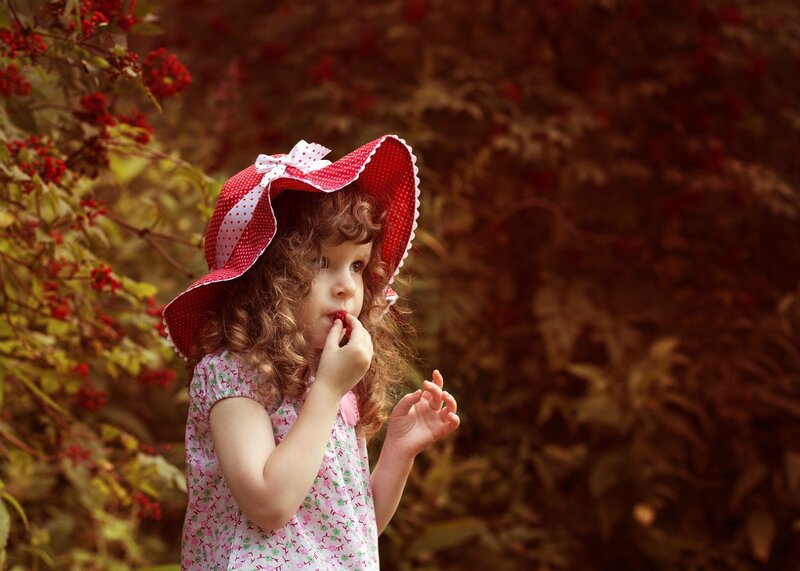 Little Girl Eating Berries