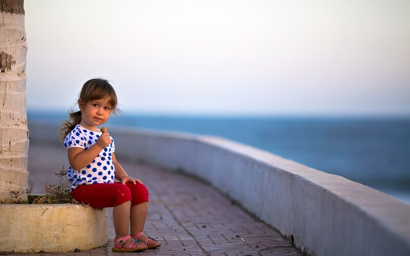 Little Girl Eating Snack