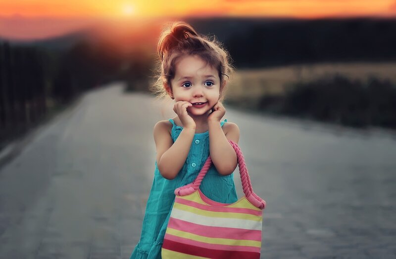 Little Girl Holding Bag