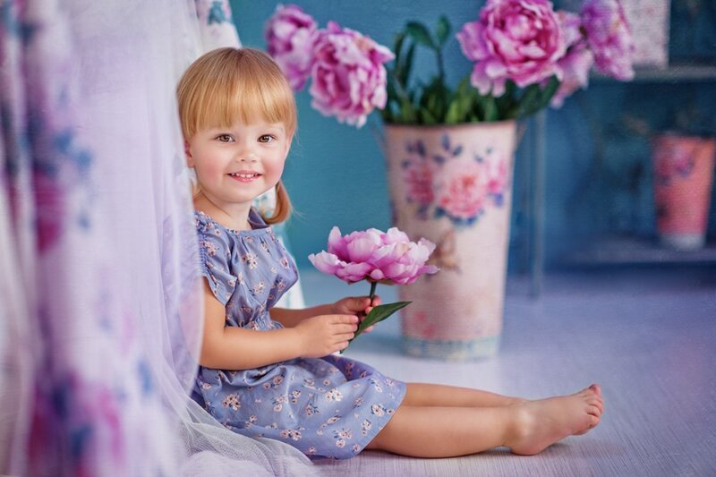 Little Girl Holding Flower