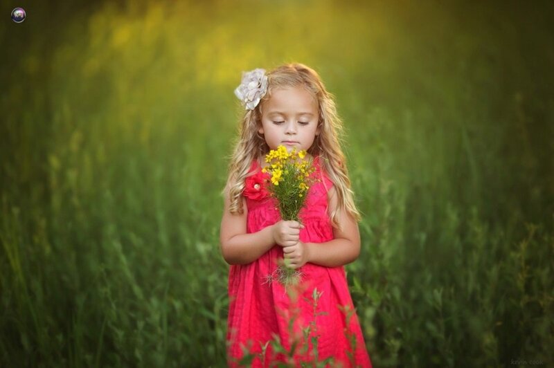 Little Girl Holding Flowers — Red