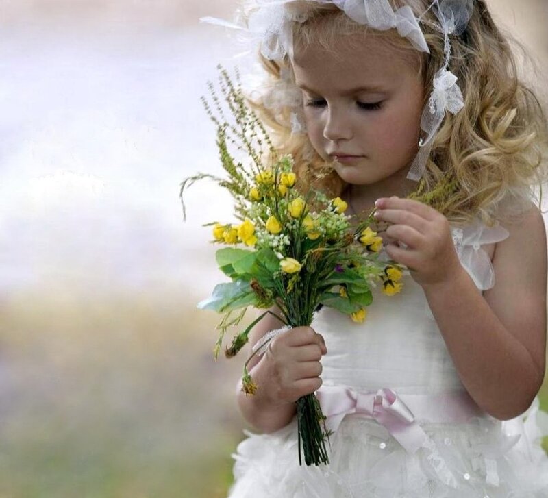 Little Girl Holding Flowers