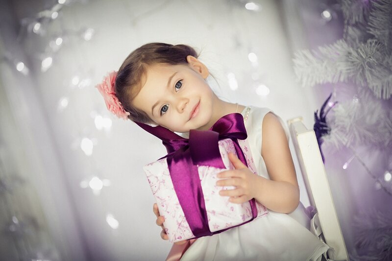 Little Girl Holding Gift