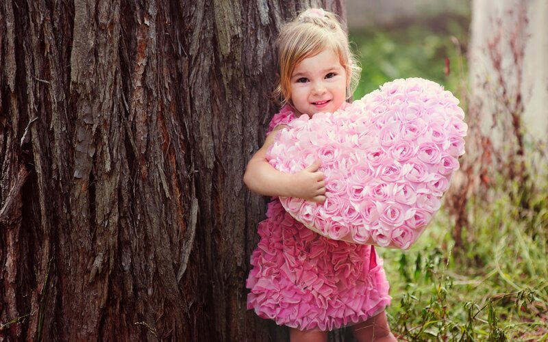 Little Girl Holding Heart — Pink