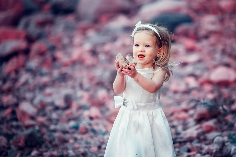 Little Girl Holding Rock