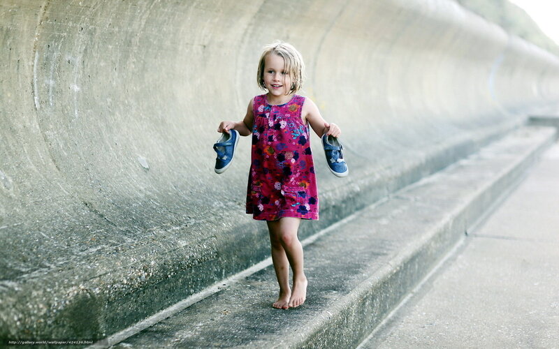 Little Girl Holding Shoes
