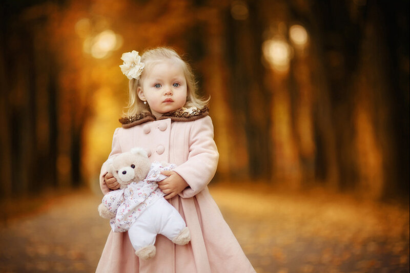 Little Girl Holding Teddy Bear
