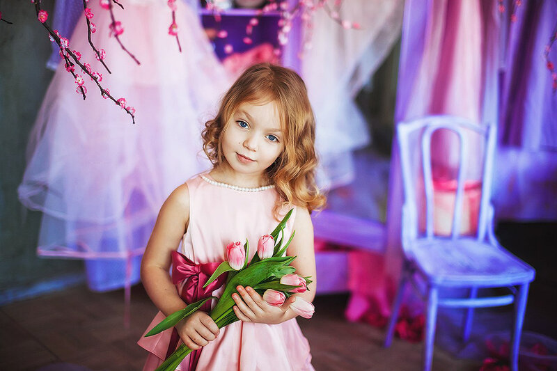 Little Girl Holding Tulips — Pink