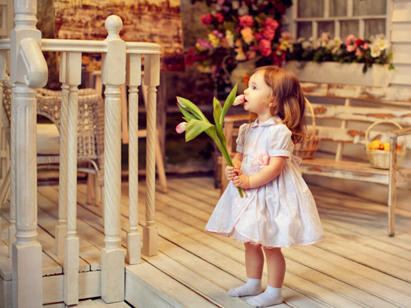 Little Girl Holding Tulips