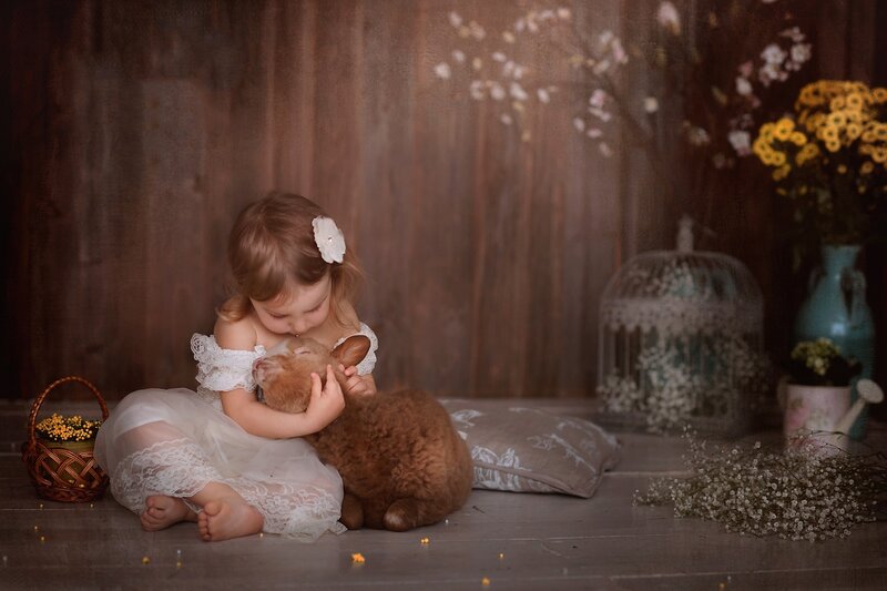 Little Girl Hugging Lamb