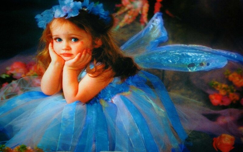little girl in blue fairy costume