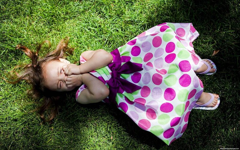 Little Girl Lying on Grass