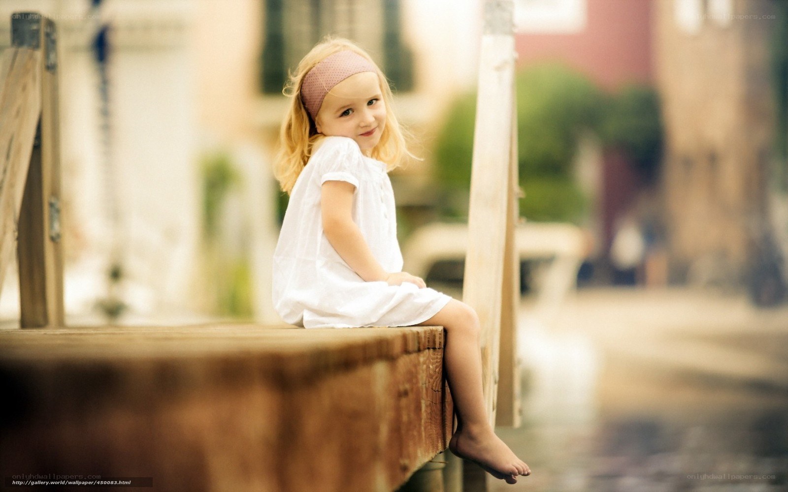 Little girl on a wooden dock