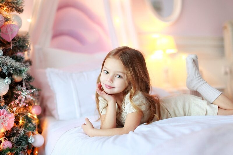 Little Girl on Bed