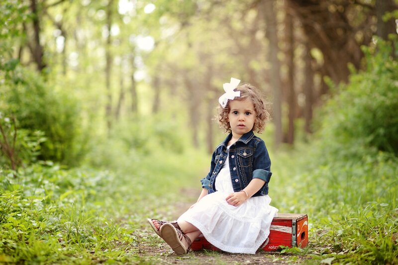 Little Girl Sitting on Box