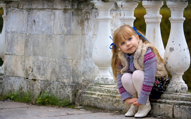 Little Girl Sitting on Steps
