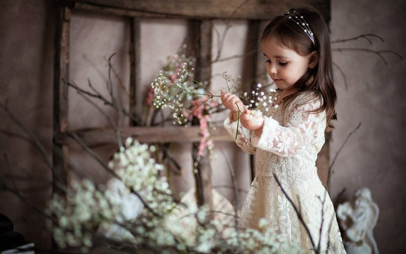 Little Girl with Flowers — White, Serene, Photograph, Branches