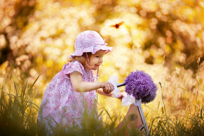 Little Girl with Purple Flower