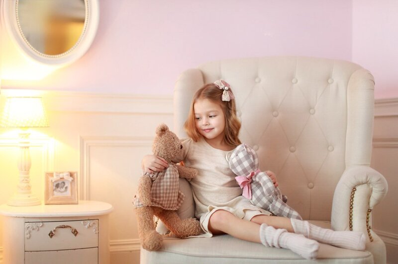 Little Girl with Teddy Bears