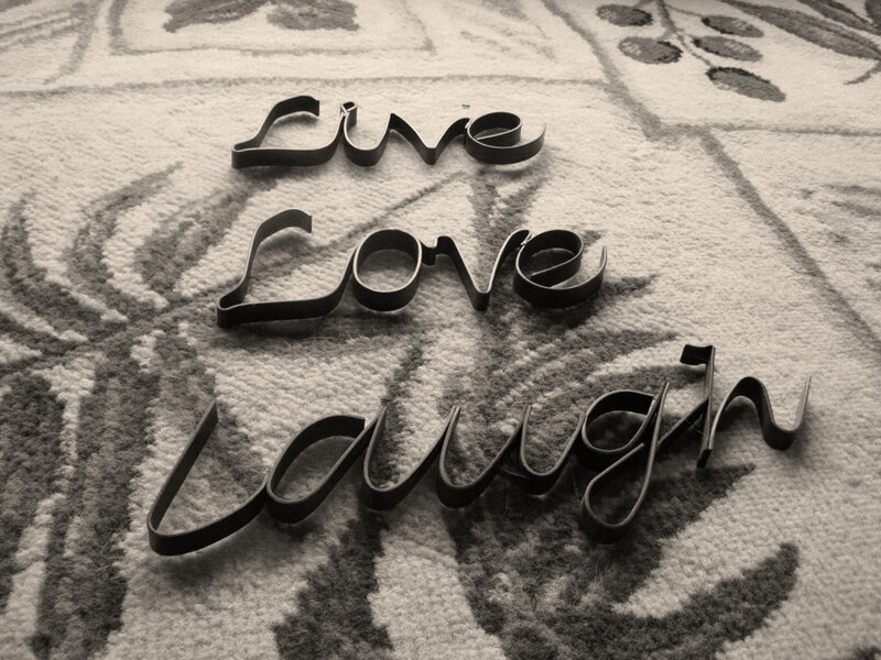 Live Love Laugh sign on carpet