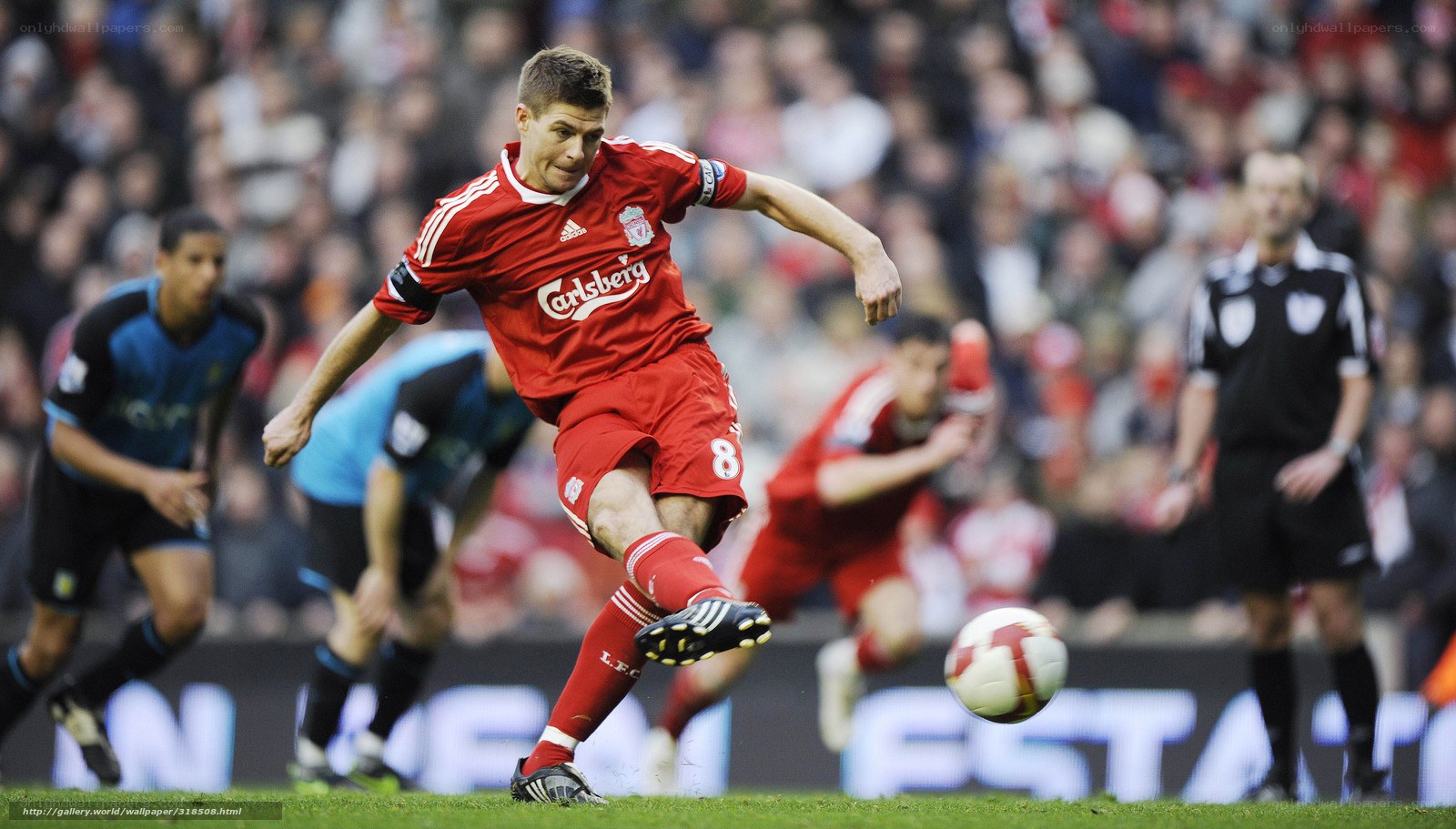 Liverpool player kicking ball