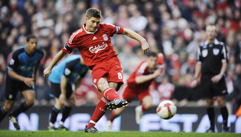 Liverpool player kicking football