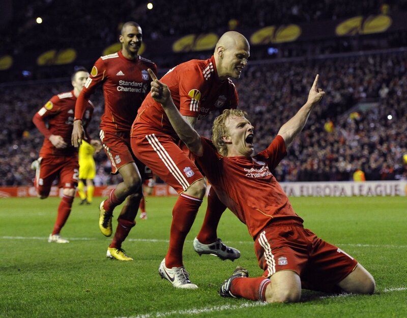 Liverpool players celebrate on field