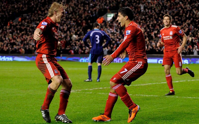 Liverpool players celebrate on the field