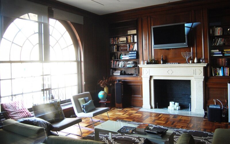Living room with fireplace and arched window