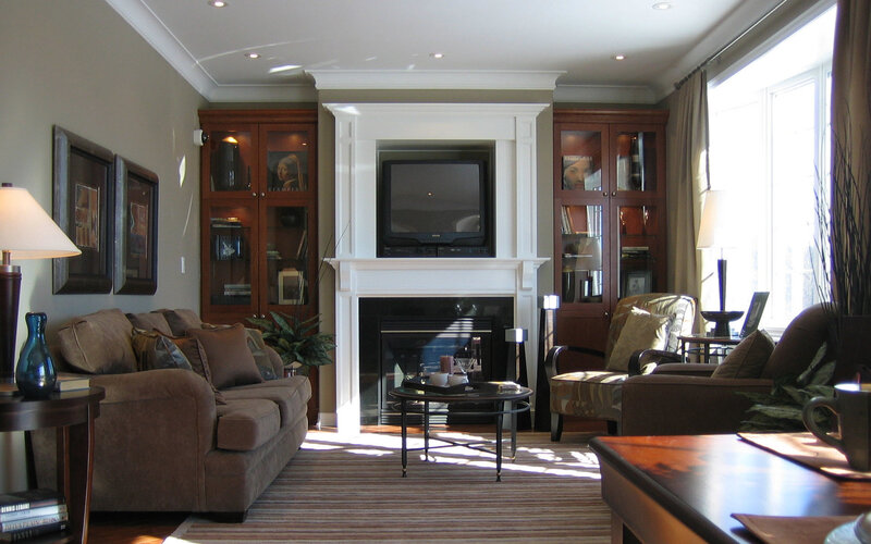 Living room with fireplace and TV