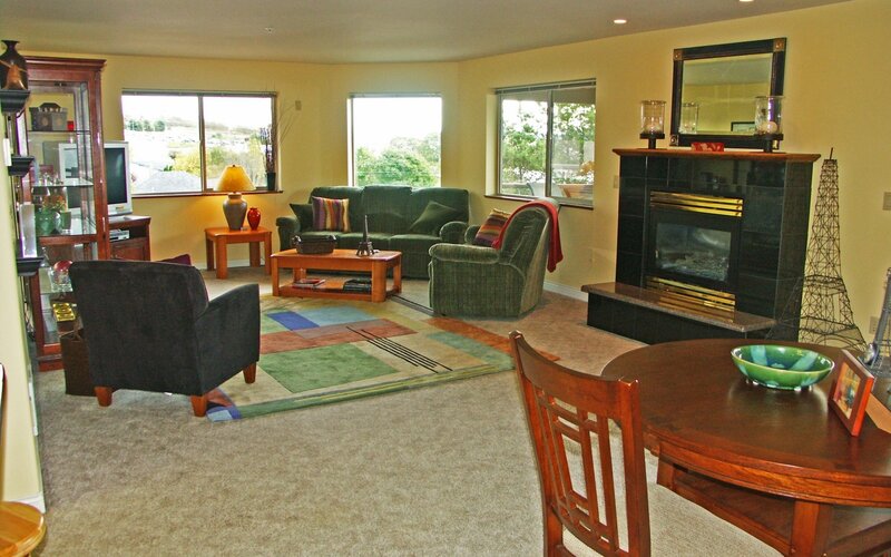Living Room with Fireplace — Beige, Cozy, Afternoon, Photograph, Sofa, Armchair