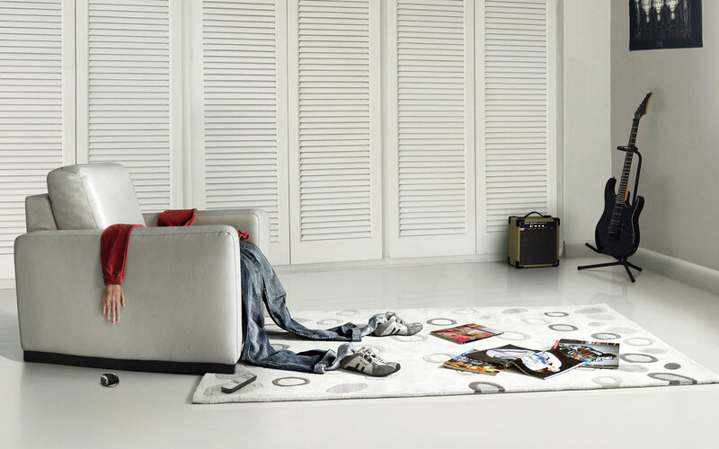 Living room with guitar and magazines