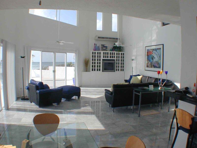 Living Room with Ocean View — White, Serene, Afternoon, Photograph, Sofa, Table