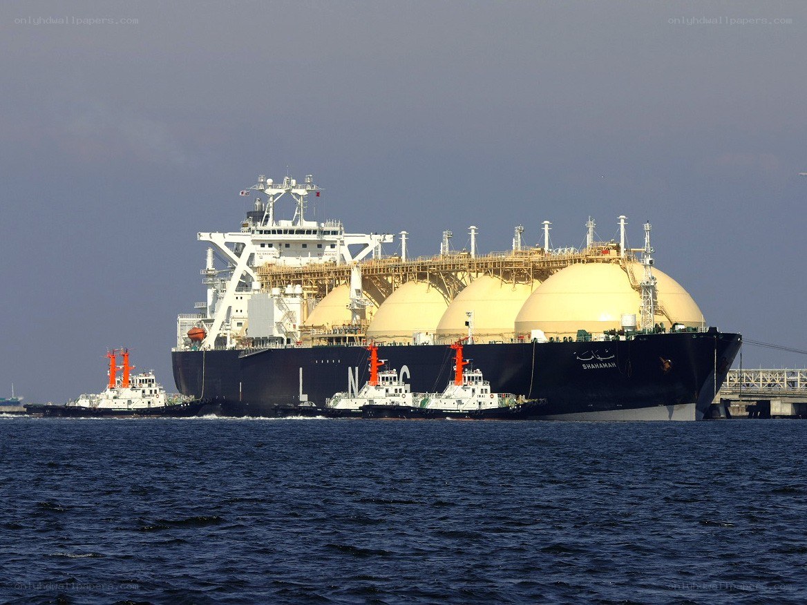 LNG tanker with tugboats