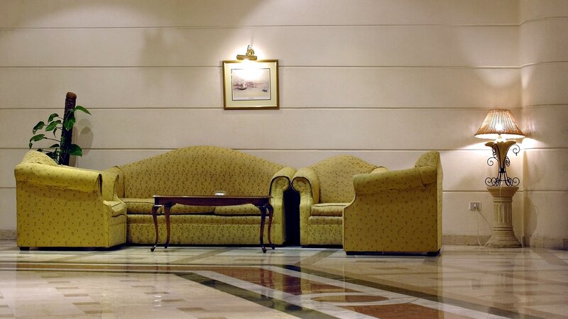 Lobby seating area with yellow furniture