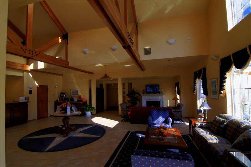 Lobby with high ceiling and wooden beams