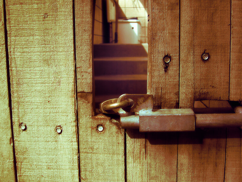 locked wooden gate with padlock