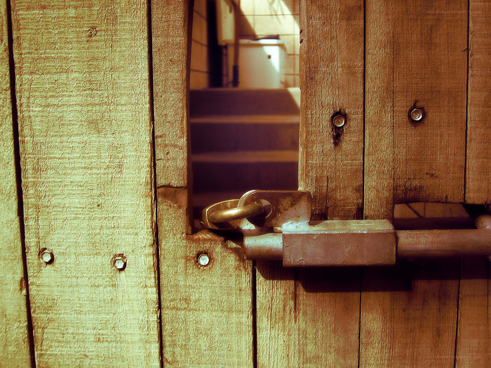 locked wooden gate with padlock
