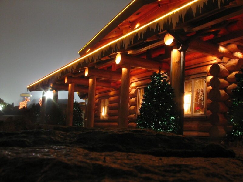 log cabin at night with lights
