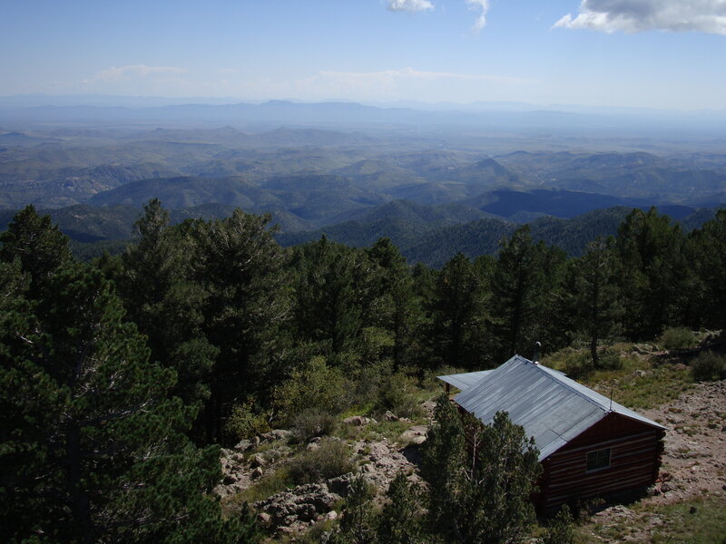 Log Cabin in Mountains — Green, Serene, Afternoon, Photograph, Trees