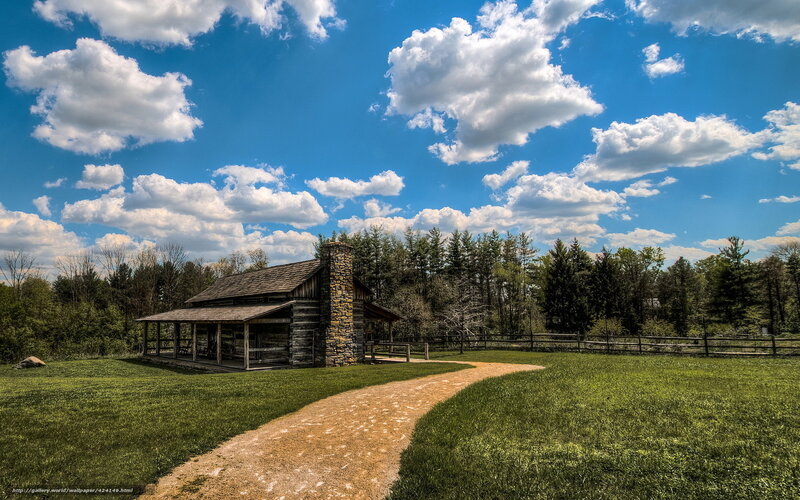 Log cabin in rural landscape