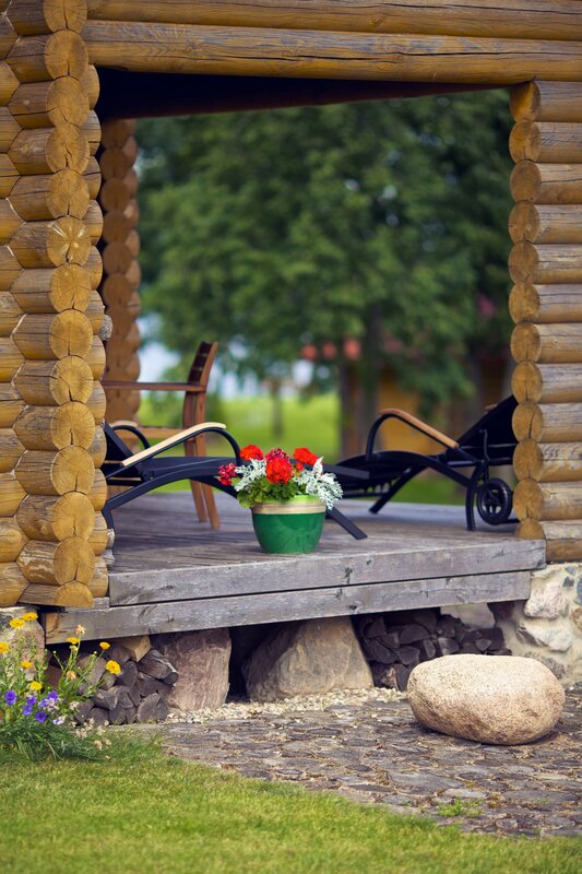 Log cabin porch with flowers
