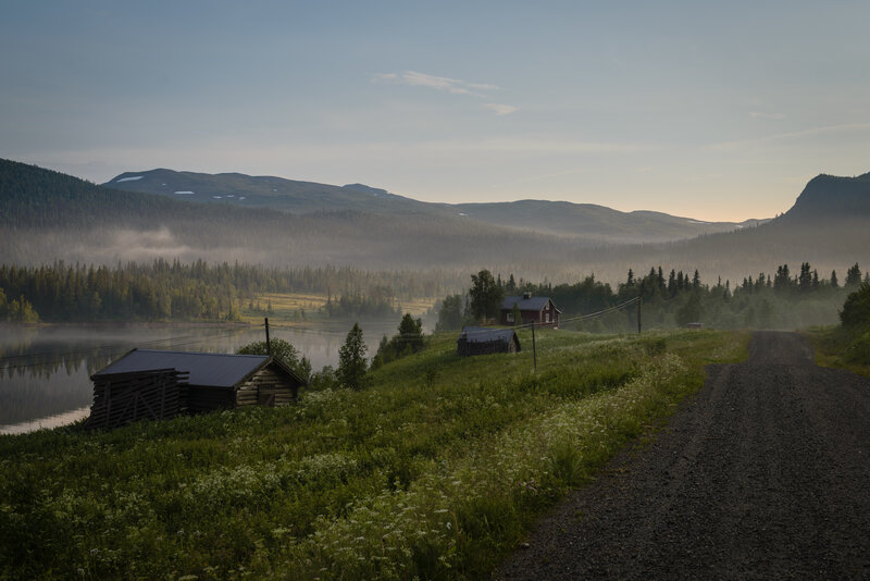 Log Cabins by Lake — Green