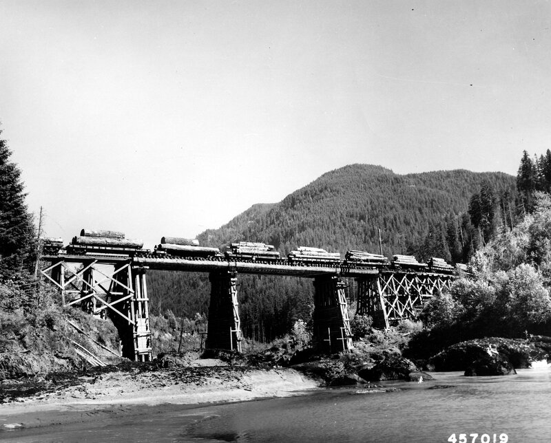Log train on trestle bridge