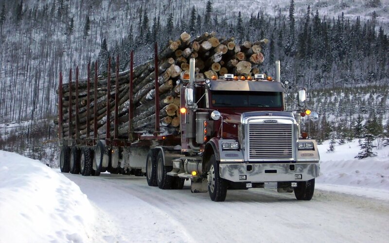 Log Truck on Snowy Road