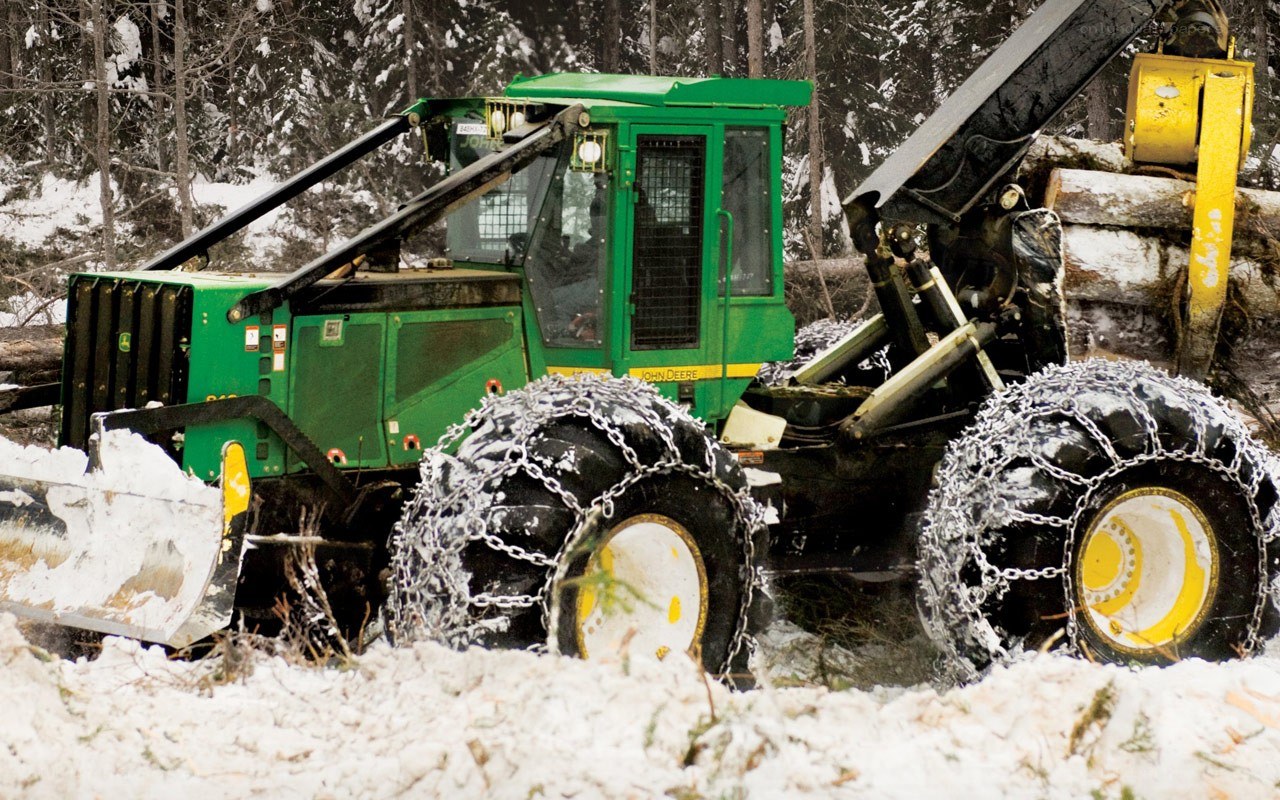 Logging truck in snowy forest