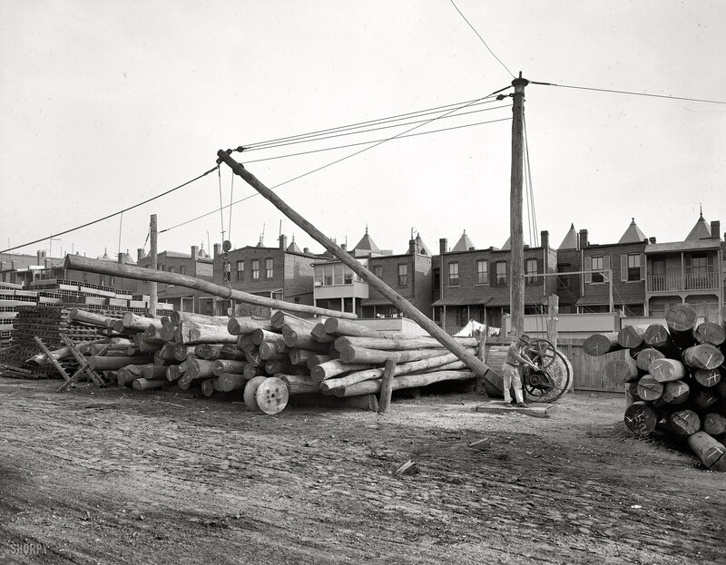 Logging yard with crane and logs