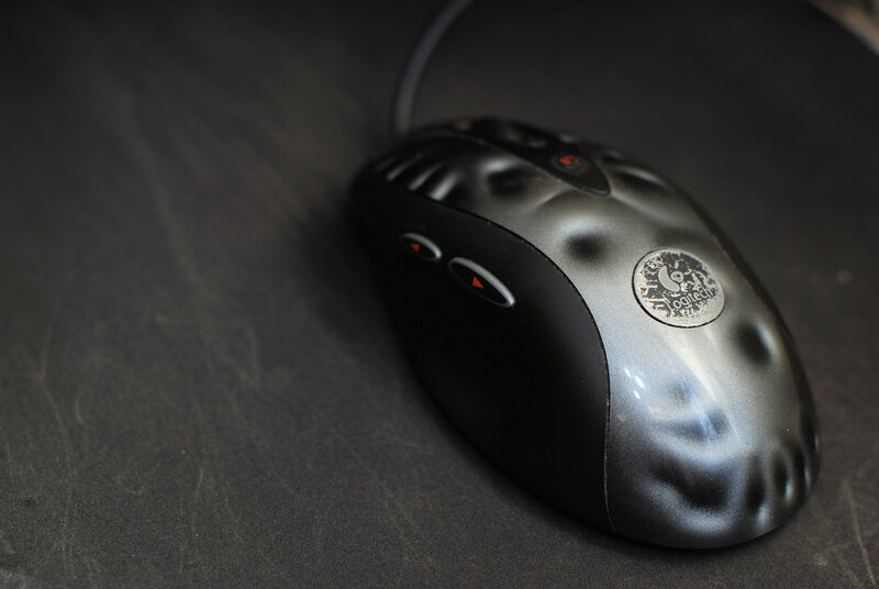 Logitech mouse on dark surface