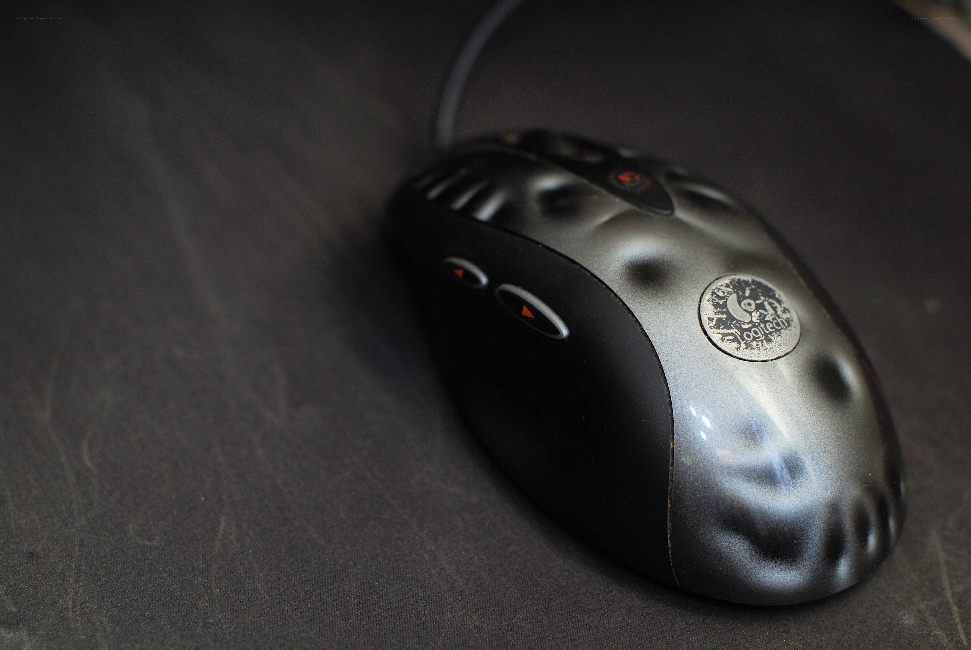 Logitech mouse on dark surface