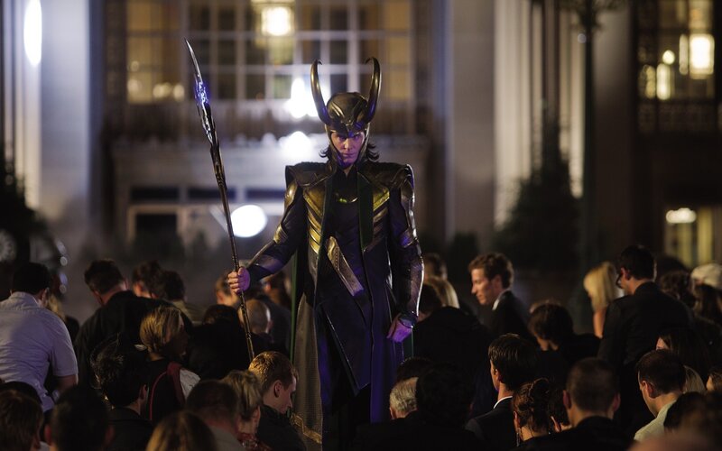 Loki stands in a crowd